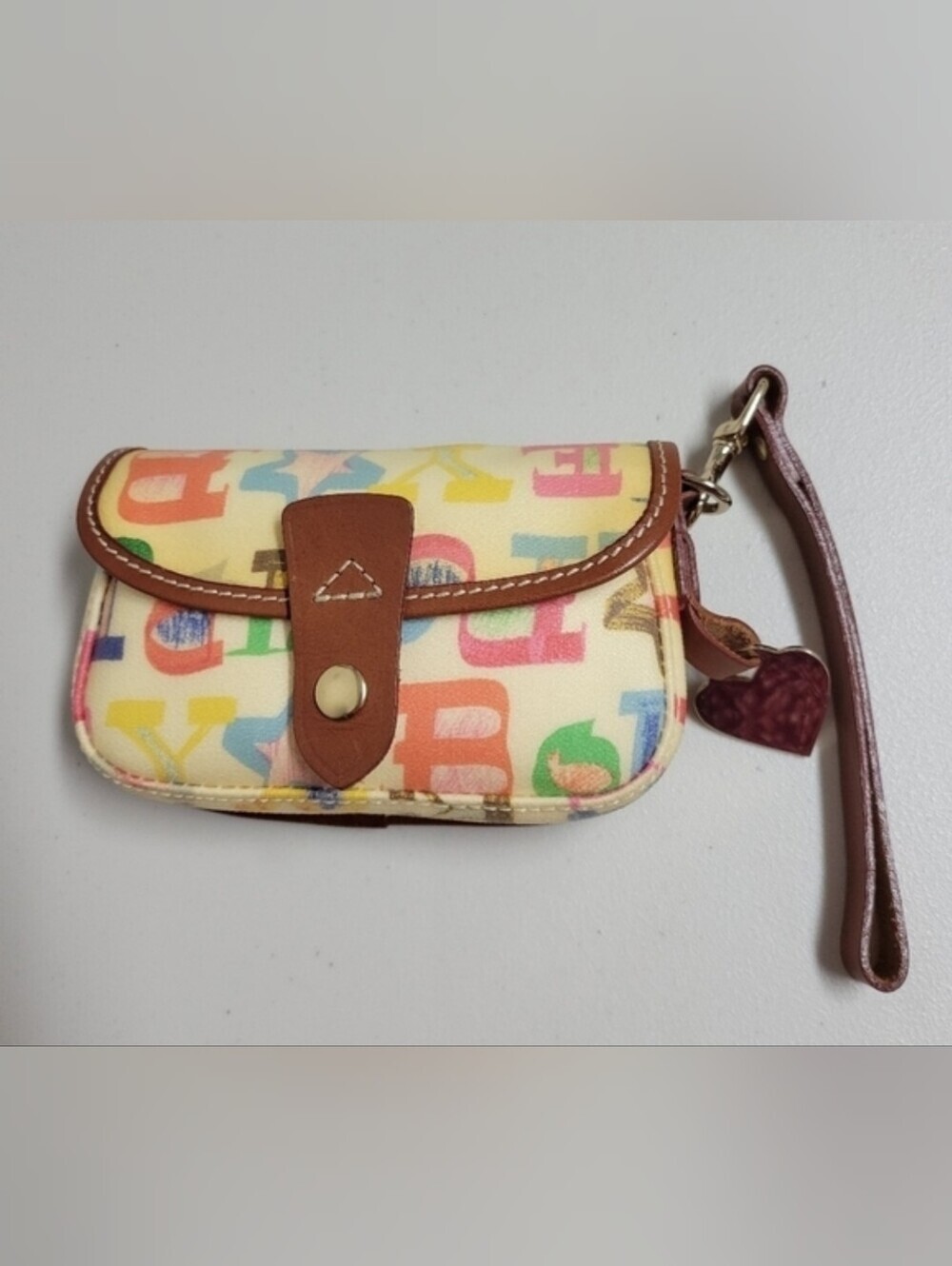 Dooney & Bourke Vintage Pouch Graffiti Canvas Leather Trim.